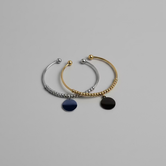 Two cuff withengraving discs on the middle.